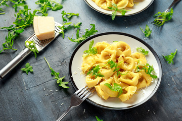 Ravioli with Parmesan and wild rocket on plate