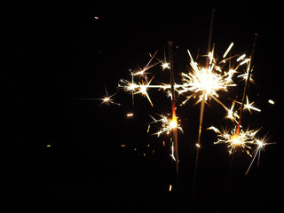 Christmas sparklers in the dark, background for xmas, new year