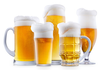 Mug of frosty light beer with foam isolated on a white background