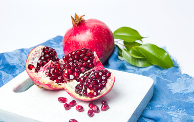 Pomegranate fruit on a cutting board