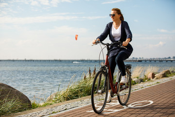 Healthy lifestyle - middle-aged woman riding bicycles