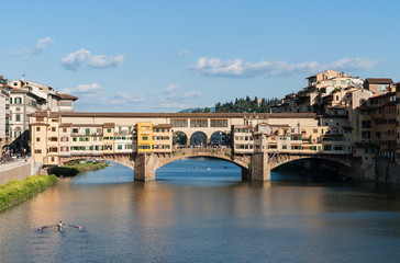 Fototapeta premium The Ponte Vecchio old bridge over river Arno - Florence, Tuscany, Italy. Built very close to the Roman crossing, the Ponte Vecchio, was the only bridge across the Arno in Florence until 1218