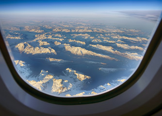 Flight over the snowy peaks of Greenland