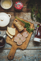 meatloaf with stuffing on a kitchen board on a wooden surface