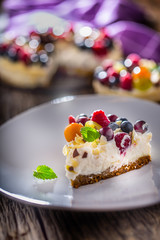 Cheesecake with fresh fruit berries strawberries raspberries and star anise. Christmas cheesecake with christmas decoration