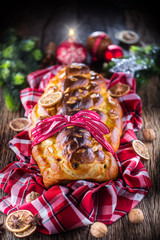 Obraz na płótnie Canvas Christmas Cake and Christmas Decorations. Christmas cake, slovak or eastern europe traditional pastry - vianocka