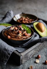 Raw avocado chocolate mousse with hazelnuts