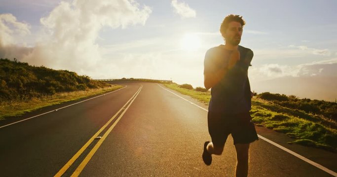 Athletic Man Running at Sunset