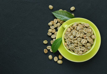 natural organic green coffee beans on a black background