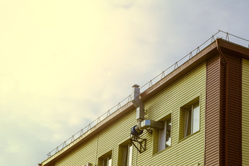 air duct and engine on the wall of the building