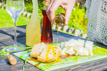 cheese, bread, apple cider, olive oil, balsamic vinegar outdoors summer