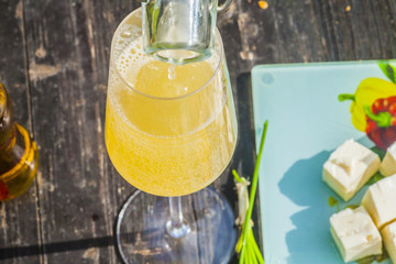 apple cider in glass on the wooden table