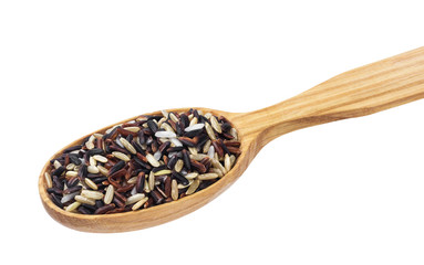 Mixed rice in wooden spoon isolated on white background. Black, red, brown, basmati rice mix