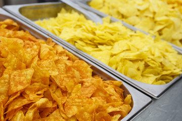 Golden chips on the counter close-up. Food