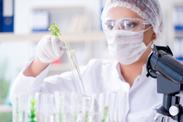Female scientist researcher conducting an experiment in a labora