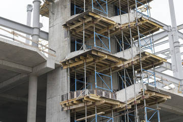 Construction of a concrete house. retaining scaffolding