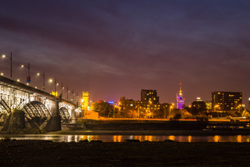 Poniatowski bridge over the Vistula river at night in Warsaw, Poland