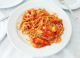 spaghetti with shrimps at a greek tavern - mediterranean seafood