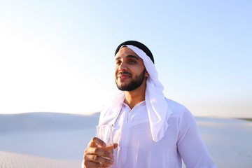 Breath of freshness of male Muslim in middle of dry climate of s