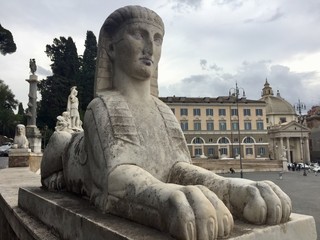 Ancient statue of Sphinx on Piazza del Popolo, Rome, Italy. On top of the walls surrounding the square, there are 16 identical sphinxes to accentuate Egyptian character of the place