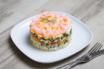 Salad with shrimps on a white plate. Selective focus, close-up.