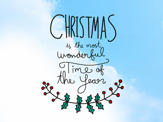 Christmas is the most wonderful time of the year word on blue sky background