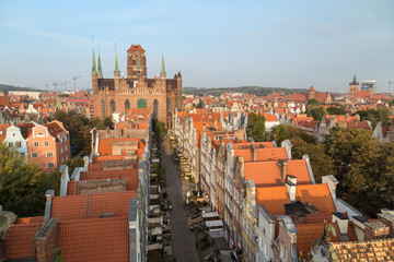 Old residential buildings, Mariacka Street and St. Mary's Church at the Main Town (Old Town) in Gdansk, Poland, viewed from above in the morning.