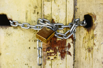 Old Wooden Door Locked With Padlock