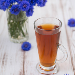 A cup of tea and flowers