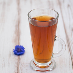 A cup of tea and flowers