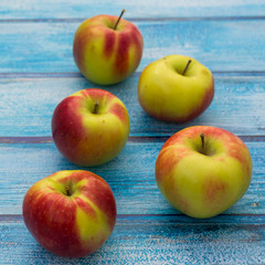 Apples on wooden background