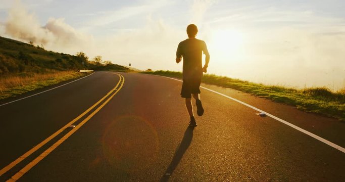 Athletic Man Running at Sunset