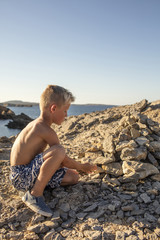 boy with rocks