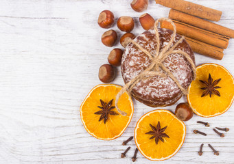 Gingerbread cookies, cinnamon and orange slices. Christmas decoration.