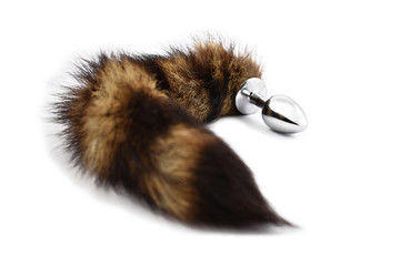 Anal plug animal tail stock photo images. Anal tail isolated on a white background. Erotic toy stock images. Adult sex toy. Butt anal plug stock images