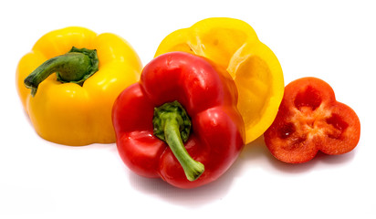 Group of cut red and yellow peppers isolated on white background.