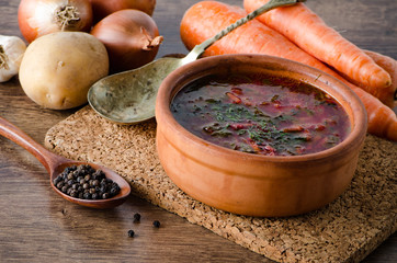 Bowl of traditional soup Borscht on table