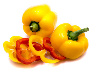 Group of peppers, yellow and red pepper slices, whole yellow isolated on white background.