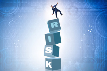 Businessman in risk and reward business concept