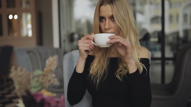Woman drink green tea in cafe