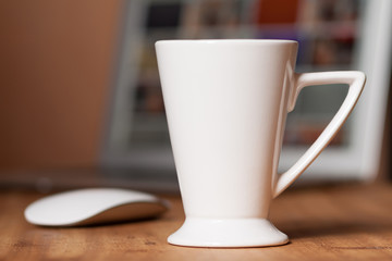 White mug on the desktop
