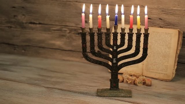 Hanukkah menorah with burning candles. Retro old style 