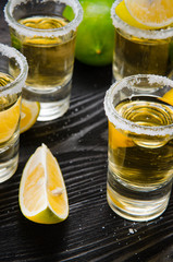 Tequila drink served in glasses with lime and salt