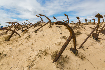 Natural Cemetery of Marine Anchors at Barril Beach, Portugal