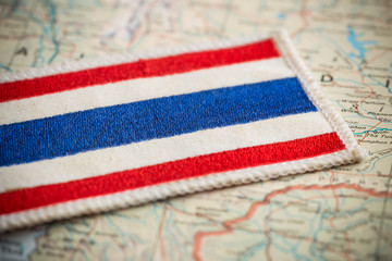 Naklejka premium Thailand flag on map