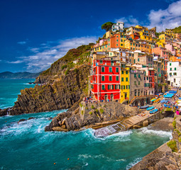 View on the colorful houses along the coastline of Cinque Terre area in Riomaggiore