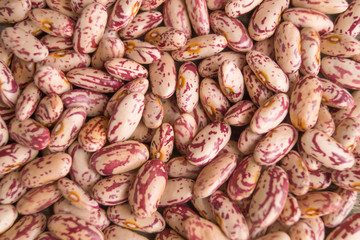 Сolorful pockmarked kidney beans as a background, texture