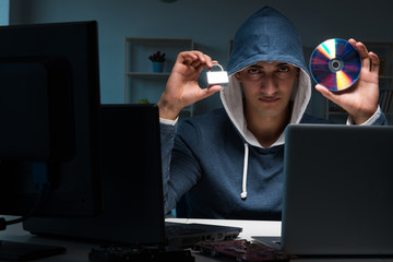 Hacker hacking computer at night
