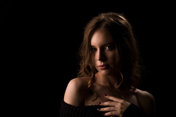 Obraz premium Portrait of young sexy light hair model woman posing on black background in studio