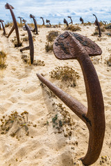 Natural Cemetery of Marine Anchors at Barril Beach, Portugal